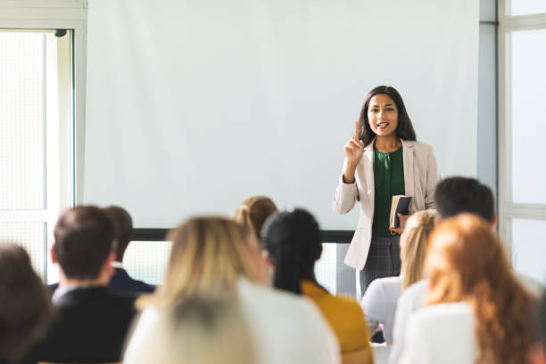 Businesswoman of Indian descent speaking at a seminar